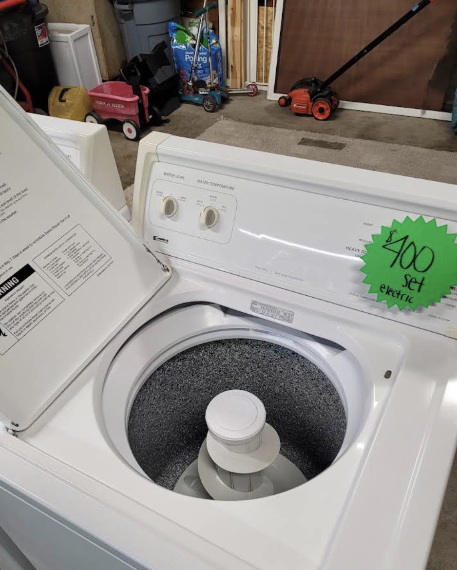 Appliance repair in progress inside a home